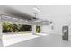 Spacious two car garage with ample lighting and overhead storage racks at 4313 Appleton Ter, North Port, FL 34286