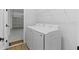 Convenient laundry area featuring new appliances and garage access at 4313 Appleton Ter, North Port, FL 34286