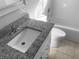 Modern bathroom features a granite vanity top, white fixtures and a bath tub at 12227 Dawn Vista Dr, Riverview, FL 33578