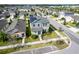 Beautiful aerial view of a two-story home with solar panels in a Gathering-friendly neighborhood at 13001 Pennybrook Dr, Riverview, FL 33579