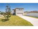 Charming two-story home features a well-manicured lawn and attached two car garage at 13001 Pennybrook Dr, Riverview, FL 33579
