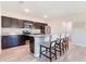 Modern kitchen equipped with stainless steel appliances, granite countertops, and bar seating at the island at 13001 Pennybrook Dr, Riverview, FL 33579
