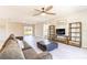 Well-lit living room with stylish furniture, contemporary design, and seamless access to the outdoor area at 13001 Pennybrook Dr, Riverview, FL 33579