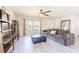 Spacious living room boasting neutral tones, modern shelving, and a comfortable sofa with decorative pillows at 13001 Pennybrook Dr, Riverview, FL 33579