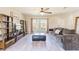 Open living area with light floors, stylish furnishings, and a view to the outdoors through bright windows at 13001 Pennybrook Dr, Riverview, FL 33579