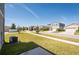 Street view featuring the well-manicured front yard of a home on a clear, sunny day at 13001 Pennybrook Dr, Riverview, FL 33579
