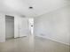 Bedroom featuring smooth surface floors and a closet with sliding doors, offering ample storage at 1540 David Pl, Englewood, FL 34223
