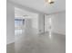 Open living room with a view to bathroom, and light-filled with neutral paint at 1540 David Pl, Englewood, FL 34223