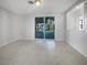 Bright living room with a sliding glass door access to the lanai at 1540 David Pl, Englewood, FL 34223