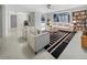 Bright living room with striped chairs, a stylish rug, and plenty of natural light at 1540 David Pl, Englewood, FL 34223