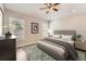 Serene bedroom with lots of natural light, featuring a comfortable bed and soft decor at 19012 Quarry Badger Rd, Land O Lakes, FL 34638