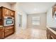 Well-equipped kitchen with stainless steel appliances and tiled flooring at 19012 Quarry Badger Rd, Land O Lakes, FL 34638