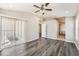 Spacious main bedroom with hardwood floors and sliding glass doors at 19012 Quarry Badger Rd, Land O Lakes, FL 34638