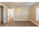 Bedroom with carpeted floor, featuring a closet and a doorway leading to other rooms at 3808 E 21St Ave, Tampa, FL 33605