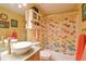 Bathroom featuring a vanity sink, toilet, and shower with a fish-themed curtain at 5769 E Price Blvd, North Port, FL 34288