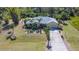 Inviting single Gathering home with palm tree landscaping, attached garage and concrete driveway at 5769 E Price Blvd, North Port, FL 34288