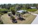 Exterior view of the property including shed, single Gathering home, and mature landscaping at 5769 E Price Blvd, North Port, FL 34288