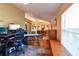 Inviting living space showcasing hardwood floors and abundant natural light from the large window at 5769 E Price Blvd, North Port, FL 34288