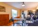 Well-lit home office featuring hardwood floors, built-in shelving, and ample workspace at 5769 E Price Blvd, North Port, FL 34288