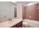 Bathroom with warm tile shower, vanity, countertop space, and neutral paint at 6160 Castleton Hollow Rd, Riverview, FL 33578