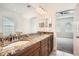 Double vanity bathroom with granite countertop and view to bedroom at 6160 Castleton Hollow Rd, Riverview, FL 33578