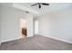 Comfortable bedroom with a ceiling fan and an ensuite bathroom at 6160 Castleton Hollow Rd, Riverview, FL 33578
