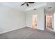 Comfortable bedroom with a ceiling fan and an ensuite bathroom at 6160 Castleton Hollow Rd, Riverview, FL 33578