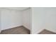 Walk-in closet with shelving, carpet, and base trim at 6160 Castleton Hollow Rd, Riverview, FL 33578
