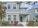 Charming blue two-story home with white trim and a welcoming front porch at 6160 Castleton Hollow Rd, Riverview, FL 33578