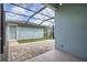 Covered patio with brick pavers and a view of the manicured lawn at 6160 Castleton Hollow Rd, Riverview, FL 33578