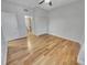 Bedroom with wood floors leading to closet and bathroom at 557 Pinellas Bayway S # 111, St Petersburg, FL 33715