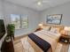 Cozy bedroom with a large window, comfortable bed, and stylish decor, creating a peaceful retreat at 557 Pinellas Bayway S # 111, St Petersburg, FL 33715