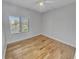 View of a hardwood floor unfurnished bedroom with a ceiling fan at 557 Pinellas Bayway S # 111, St Petersburg, FL 33715