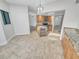 Open kitchen with island and wine cooler; tile floors and granite countertops at 557 Pinellas Bayway S # 111, St Petersburg, FL 33715