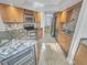 Well-appointed kitchen with stainless steel appliances, granite countertops, and ample cabinet space at 557 Pinellas Bayway S # 111, St Petersburg, FL 33715