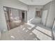 Screened-in lanai with sink and sliding glass door into the interior living space at 557 Pinellas Bayway S # 111, St Petersburg, FL 33715