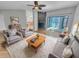 Comfortable living room with a fireplace, plush seating, and a sliding glass door leading to a patio at 557 Pinellas Bayway S # 111, St Petersburg, FL 33715