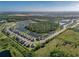 An aerial view showcasing a well-planned community with lush green spaces and serene ponds at 12654 Oak Hill Way, Parrish, FL 34219