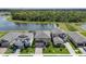 An aerial view shows properties near the lake with well-maintained lawns at 12654 Oak Hill Way, Parrish, FL 34219