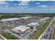 A comprehensive aerial perspective of the shopping center, showcasing its array of stores and busy roads at 12654 Oak Hill Way, Parrish, FL 34219