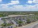 Aerial view of a Publix supermarket surrounded by parking and lush greenery under a bright sky at 12654 Oak Hill Way, Parrish, FL 34219
