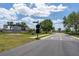 A view of the Crosswind Point entrance sign off the main road at 12654 Oak Hill Way, Parrish, FL 34219