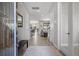 Open foyer leads into a bright, spacious living area with tile flooring and modern decor at 12654 Oak Hill Way, Parrish, FL 34219