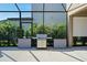 Stainless steel grill on outdoor patio with lush landscaping at 12654 Oak Hill Way, Parrish, FL 34219