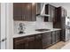 Gourmet kitchen featuring rich brown cabinets, stainless steel appliances, and sleek countertops at 12654 Oak Hill Way, Parrish, FL 34219