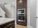 Gourmet kitchen boasts stainless steel appliances, dark cabinetry, and a convenient built-in microwave and oven at 12654 Oak Hill Way, Parrish, FL 34219