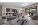 Spacious living room with an open layout to the kitchen and dining area, and sliding doors to the patio at 12654 Oak Hill Way, Parrish, FL 34219