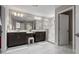 Main bathroom featuring marble floors, dual sinks, and a large glass enclosed shower at 12654 Oak Hill Way, Parrish, FL 34219