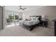 Bright main bedroom features plush carpet, lots of natural light, and a ceiling fan at 12654 Oak Hill Way, Parrish, FL 34219