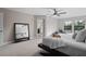 Bright main bedroom features plush carpet, lots of natural light, and access to a luxury bathroom at 12654 Oak Hill Way, Parrish, FL 34219